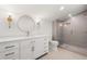 Bright bathroom features a double vanity, modern fixtures, and a glass-enclosed shower at 4620 Riverview Blvd, Bradenton, FL 34209