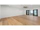 Bedroom featuring wood floors and sliding doors leading to patio at 4620 Riverview Blvd, Bradenton, FL 34209