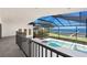 View from the enclosure to the pool, spa, outdoor space, boat dock and the bay at 4620 Riverview Blvd, Bradenton, FL 34209