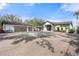 Stately home exterior showcasing lush landscaping, a garage, and a large driveway at 4620 Riverview Blvd, Bradenton, FL 34209