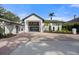 Modern white house with black trim and a large brick driveway at 4620 Riverview Blvd, Bradenton, FL 34209