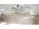 A large, bright garage with high ceilings, two automatic doors, and ample lighting at 4620 Riverview Blvd, Bradenton, FL 34209