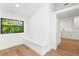Bright hallway with window seat leads into the laundry room at 4620 Riverview Blvd, Bradenton, FL 34209