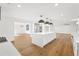 Open concept kitchen with large island, stainless steel appliances and wood floors at 4620 Riverview Blvd, Bradenton, FL 34209