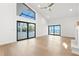 A large living room features hardwood floors, access to a patio, and abundant natural light at 4620 Riverview Blvd, Bradenton, FL 34209