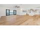 Open living space with wood floors and modern kitchen at 4620 Riverview Blvd, Bradenton, FL 34209