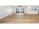 Spacious living area with wood floors and access to the patio at 4620 Riverview Blvd, Bradenton, FL 34209
