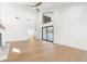 Open-concept living area boasts a fireplace, high ceilings, and hardwood floors at 4620 Riverview Blvd, Bradenton, FL 34209