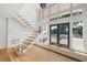 Bright entry with wood floors and modern staircase at 4620 Riverview Blvd, Bradenton, FL 34209
