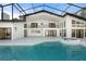 Spacious outdoor pool and patio area, enclosed in screen and attached to the house at 4620 Riverview Blvd, Bradenton, FL 34209