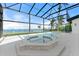 Beautiful screened-in pool and spa offering scenic waterfront views at 4620 Riverview Blvd, Bradenton, FL 34209