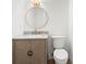 Modern powder room features stylish vanity, round mirror, and updated fixtures at 4620 Riverview Blvd, Bradenton, FL 34209