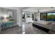 Bright bedroom featuring stylish decor, neutral colors, and a private balcony at 5236 Siesta Cove Dr, Sarasota, FL 34242
