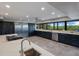 Modern kitchen with stainless steel appliances, ample counter space, and cabinetry at 5236 Siesta Cove Dr, Sarasota, FL 34242