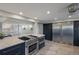 Modern kitchen features stainless steel appliances, ample counter space at 5236 Siesta Cove Dr, Sarasota, FL 34242