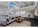 Bright and airy living room features a unique staircase, neutral decor, and a cozy seating area at 5236 Siesta Cove Dr, Sarasota, FL 34242