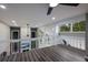 Spacious loft with wood floors, overlooking a living room, and filled with natural light from large windows at 5236 Siesta Cove Dr, Sarasota, FL 34242