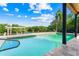 Sparkling pool with a serene waterfront backdrop and a convenient dock for boating enthusiasts at 5236 Siesta Cove Dr, Sarasota, FL 34242