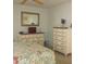 Bedroom with floral comforter, and bright natural light at 6227 Green View Cir # 77, Sarasota, FL 34231