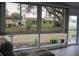 Bright sun room with large windows offering views of the backyard and surrounding greenery at 6227 Green View Cir # 77, Sarasota, FL 34231