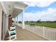 Relaxing balcony with comfortable seating and a view of the lush golf course at 6409 Stone River Rd, Bradenton, FL 34203