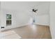 Bright bedroom with light wood flooring, a ceiling fan, and natural light at 6409 Stone River Rd, Bradenton, FL 34203