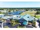 Aerial view of the clubhouse, tennis courts, and lake at Tara Golf and Country Club in Bradenton, Florida at 6409 Stone River Rd, Bradenton, FL 34203
