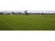Sprawling green golf course driving range, perfect for practice or a leisurely game at 6409 Stone River Rd, Bradenton, FL 34203