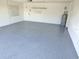 Clean, well lit garage with newly epoxied floor and water heater at 6409 Stone River Rd, Bradenton, FL 34203