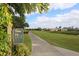 Scenic golf course views from the 10th hole, a par 5, with lush greenery and mature trees at 6409 Stone River Rd, Bradenton, FL 34203