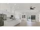 Spacious modern kitchen with white cabinets, stainless steel appliances, and views to screened patio at 6409 Stone River Rd, Bradenton, FL 34203
