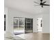 Open living area features a sliding glass door leading to the backyard at 6409 Stone River Rd, Bradenton, FL 34203
