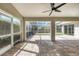 Spacious screened-in patio featuring brick flooring and a view of the backyard at 6409 Stone River Rd, Bradenton, FL 34203