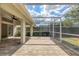 Covered and screened-in patio with brick flooring, ideal for outdoor relaxation at 6409 Stone River Rd, Bradenton, FL 34203