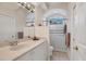Bathroom featuring single sink with white vanity and glass enclosed shower at 6922 Stanhope Pl, University Park, FL 34201