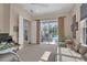 Comfortable bedroom with large sliding doors and a cozy seating area at 6922 Stanhope Pl, University Park, FL 34201