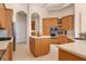 Well-lit kitchen with stainless steel appliances and a central island at 6922 Stanhope Pl, University Park, FL 34201
