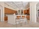 Open kitchen featuring an island with seating and stainless steel appliances at 6922 Stanhope Pl, University Park, FL 34201