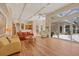 Open-concept living room with hardwood floors and view of the screened lanai at 6922 Stanhope Pl, University Park, FL 34201
