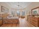 Bright main bedroom featuring a comfortable bed and natural lighting at 6922 Stanhope Pl, University Park, FL 34201