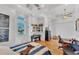 Bedroom featuring wood floors, ceiling fan, eclectic decor, and natural light at 7064 Hawks Harbor Cir, Bradenton, FL 34207