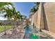 Serene outdoor water feature complemented by lush tropical plants and an elegant stone walkway at 7064 Hawks Harbor Cir, Bradenton, FL 34207