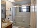 Bathroom with a glass-enclosed shower, granite countertop, and neutral color palette at 7113 52Nd E Dr, Bradenton, FL 34203