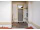 Front entrance with tile flooring, natural light, and a decorative HOME sign at 7113 52Nd E Dr, Bradenton, FL 34203
