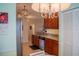 Kitchen featuring wood cabinetry, granite countertops, stainless steel appliances, and eat-in dining at 7113 52Nd E Dr, Bradenton, FL 34203