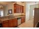 Spacious kitchen with stainless steel appliances, stone countertops, and ample cabinet space at 7113 52Nd E Dr, Bradenton, FL 34203
