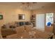 Comfortable living room featuring plush seating, natural light, and elegant decor at 7113 52Nd E Dr, Bradenton, FL 34203
