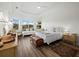 Bright, spacious bedroom with tray ceiling, wood floors, and views of the lake at 8284 Barton Farms Blvd, Sarasota, FL 34240
