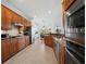 Spacious kitchen boasts custom wood cabinets, granite countertops, and stainless steel appliances at 8284 Barton Farms Blvd, Sarasota, FL 34240