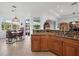 An open kitchen offers granite counters, custom cabinets, and a breakfast nook with a stunning view at 8284 Barton Farms Blvd, Sarasota, FL 34240